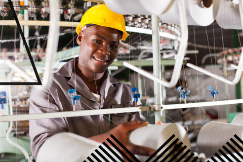 Man in hard hat in a factory