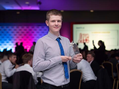 Winner of the Final Year Award, Harry Halford holding his award